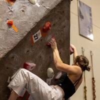 BYOB finalist on the initial moves of a steeply angled climb